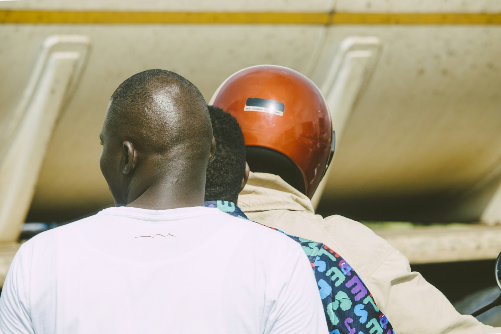 Motorbike rider and passenger wearing a helmet